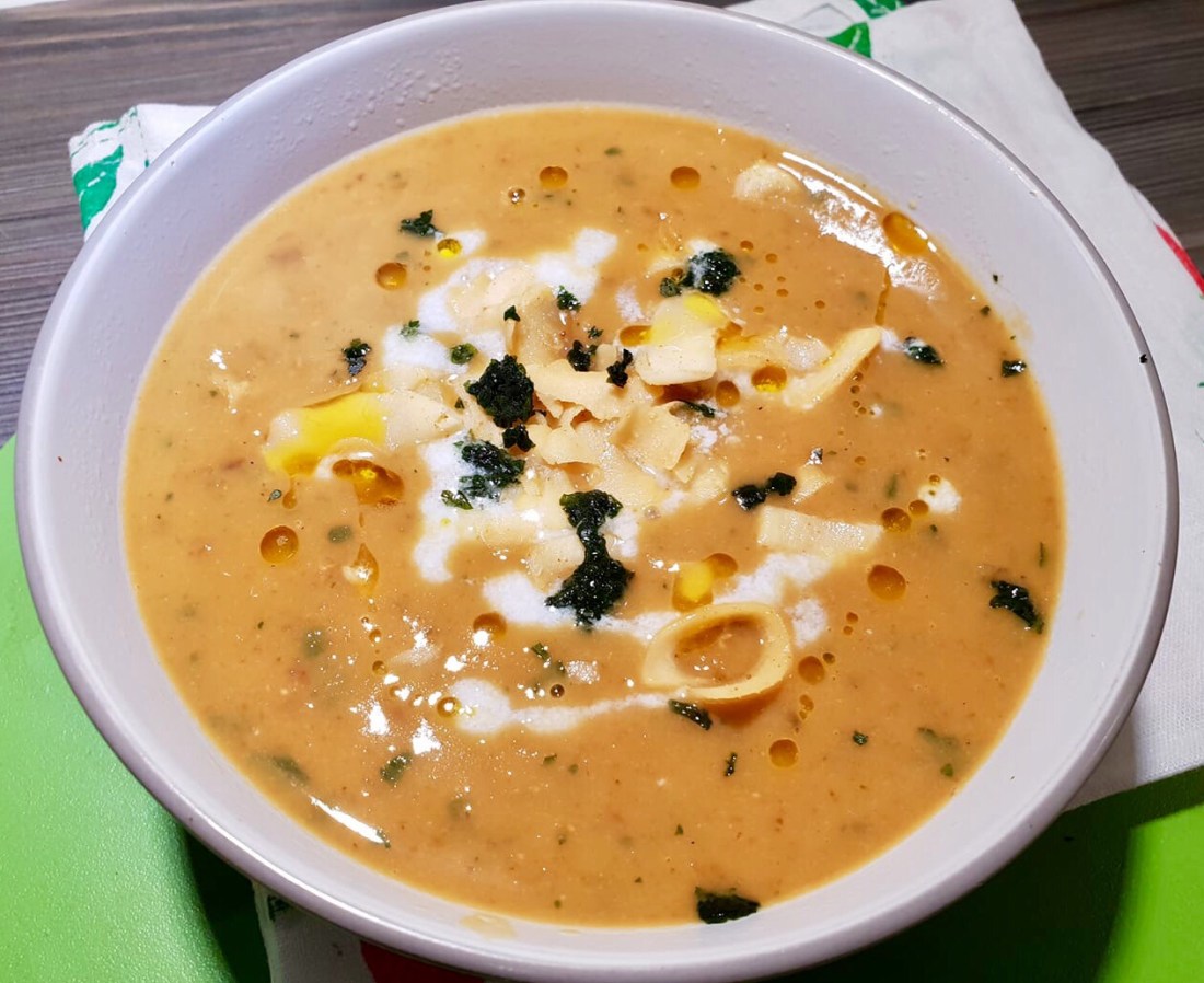 A large bowl of butternut squash and sweet potato soup