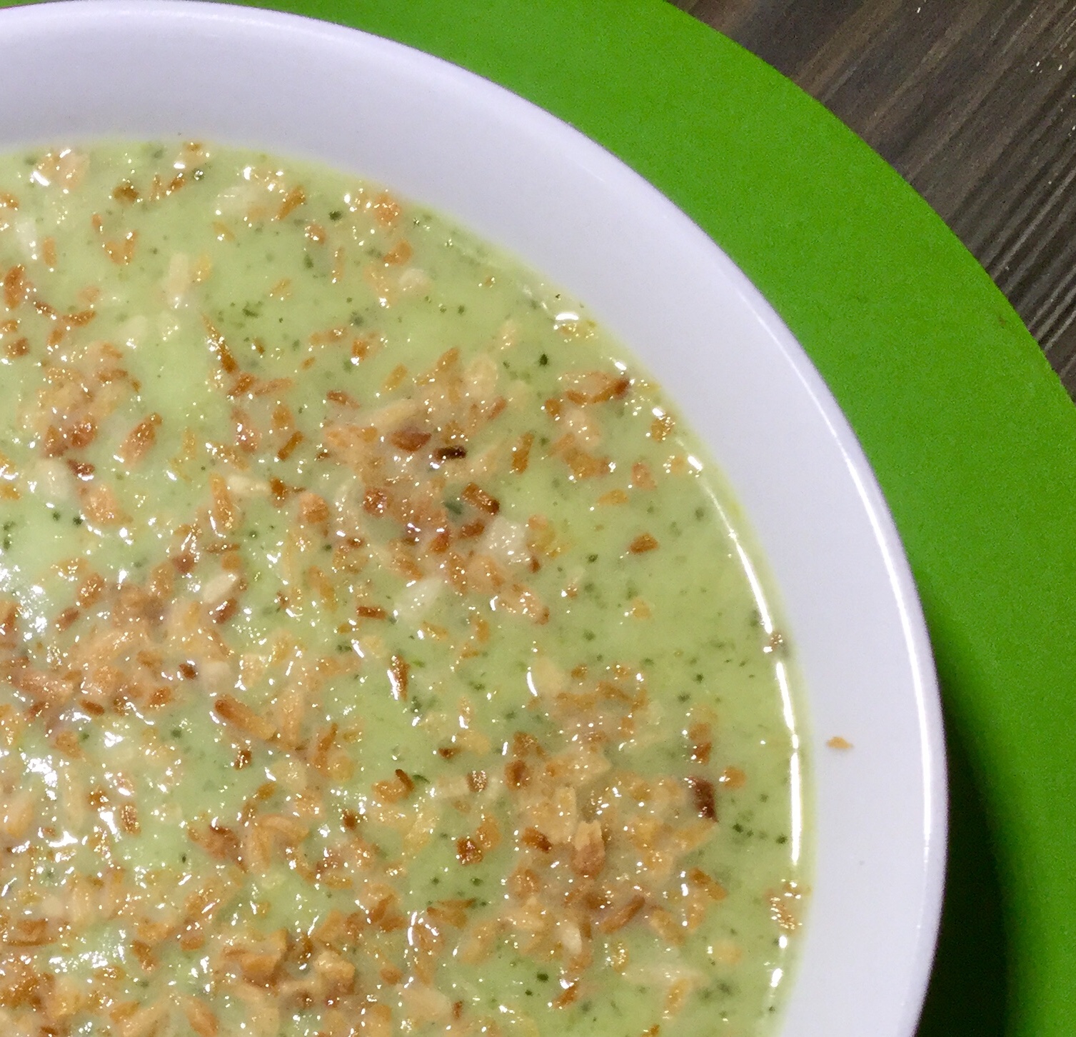 A bowl of broccoli and coconut soup