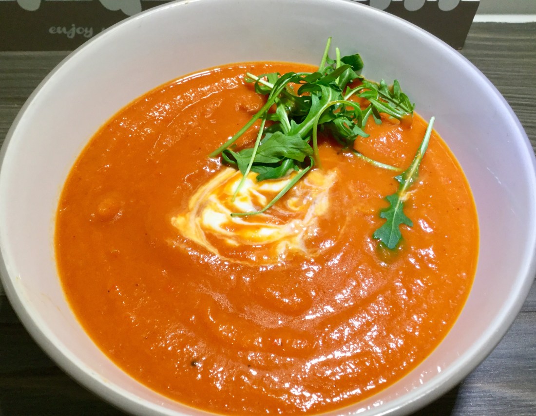 A bowl of roasted red pepper soup
